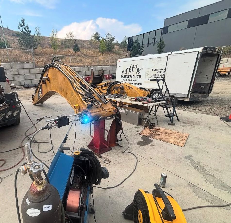 Professional structural welding work at an industrial site near Lumby